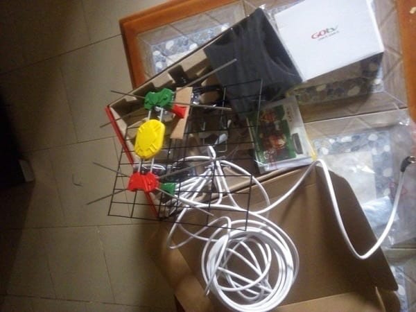 GOtv antenna kit contents laid out including the grid, coaxial cable, and colored clips