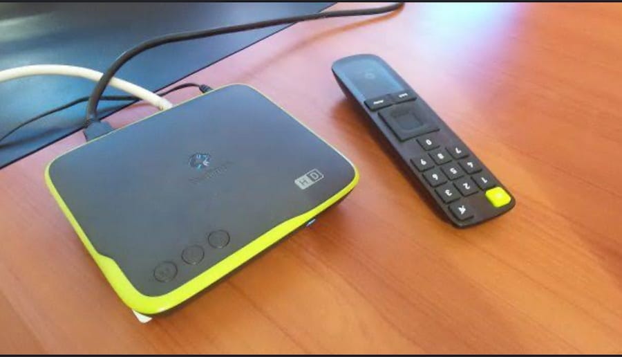StarTimes HD decoder and remote control on a wooden table in Nigeria