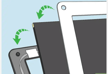 Place the screen in the metal frame on the laptop
