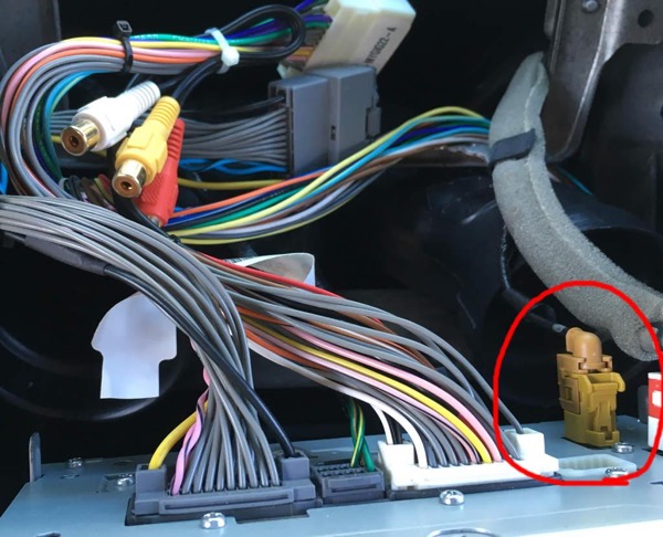 Close-up of SiriusXM antenna cable connection and wiring between antenna and tuner