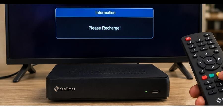 A television screen displaying a please recharge message next to a digital TV decoder.