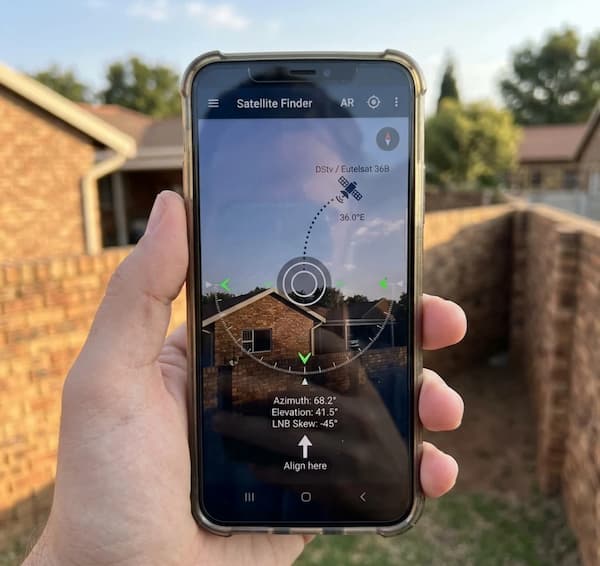 Satellite finder app on a phone showing where to point a DStv dish.