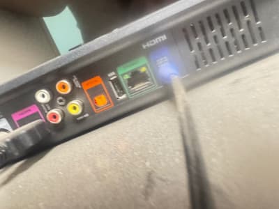 Satellite cable connected to the LNB IN socket on the back of a DStv decoder