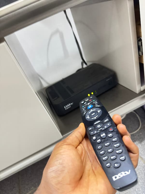 DStv remote pointed directly at the front sensor of a decoder with nothing blocking it