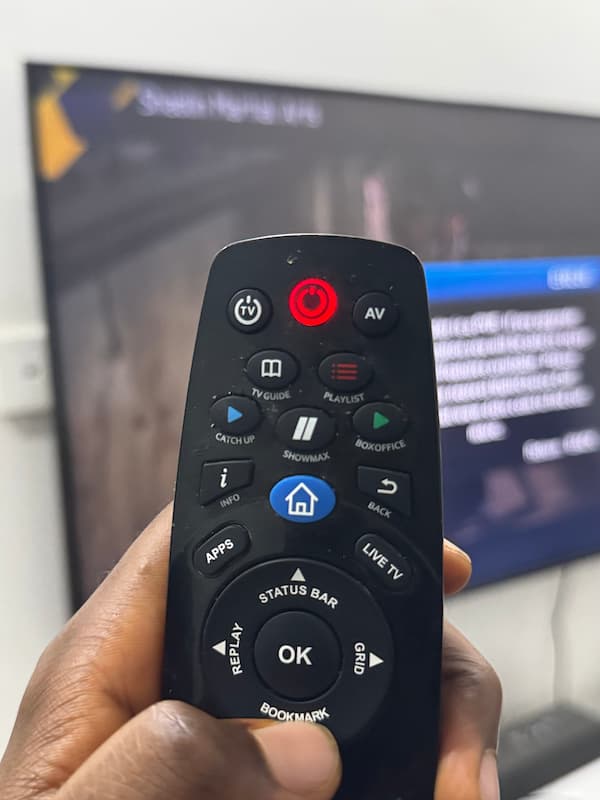 Testing a DStv remote with a phone camera, showing the infrared light flashing.