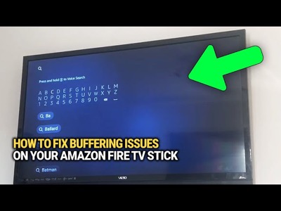 Amazon Firestick remote in hand with TV showing loading circle buffering screen