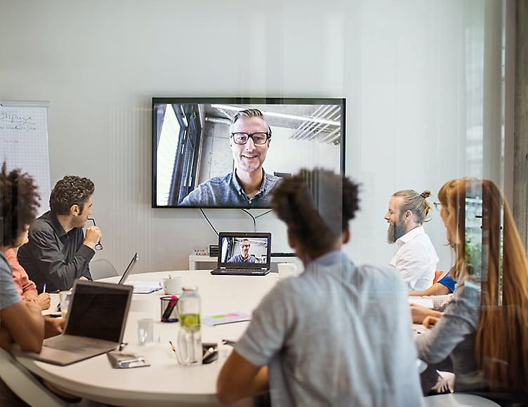 Business team in a modern meeting room participating in a video conference call using high-speed fiber internet